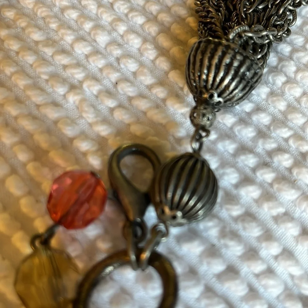 Women’s double chain belt. One of metal objects and the second chain of pearls.